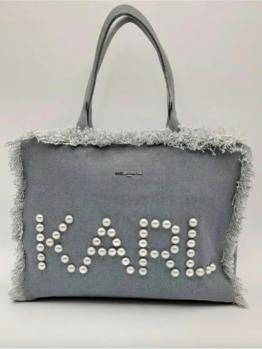 Karl Lagerfeld Paris Margot denim totefeaturing pearl embellishments fringe trim